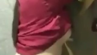Busty girl and her friend have sneaky sex in fitting room